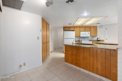 Discover the perfect blend of comfort, convenience, and on Apache Wells Country Club in Arizona - for sale on GolfHomes.com, golf home, golf lot