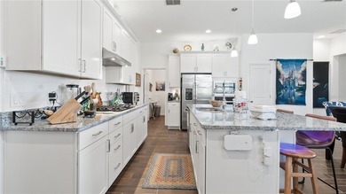 This is a SANDPIPER VILLA featuring large open concept kitchen on Mystic Dunes Resort and Golf Club in Florida - for sale on GolfHomes.com, golf home, golf lot