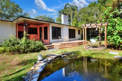 PRICE REDUCED!! ATTENTION: This Lake Hollingsworth mid-century on Cleveland Heights Golf Course in Florida - for sale on GolfHomes.com, golf home, golf lot