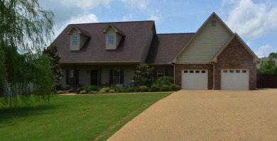 Summertime and the living is easy at this spacious 3 bedroom, 2 on Big Oaks Golf Club in Mississippi - for sale on GolfHomes.com, golf home, golf lot