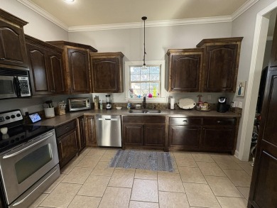 Summertime and the living is easy at this spacious 3 bedroom, 2 on Big Oaks Golf Club in Mississippi - for sale on GolfHomes.com, golf home, golf lot