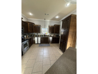 Summertime and the living is easy at this spacious 3 bedroom, 2 on Big Oaks Golf Club in Mississippi - for sale on GolfHomes.com, golf home, golf lot