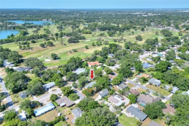 PRICE REDUCED!! ATTENTION: This Lake Hollingsworth mid-century on Cleveland Heights Golf Course in Florida - for sale on GolfHomes.com, golf home, golf lot