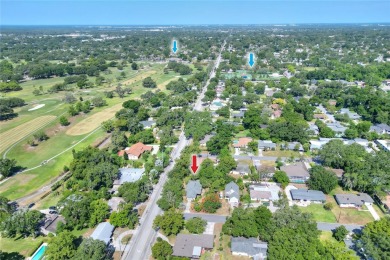 PRICE REDUCED!! ATTENTION: This Lake Hollingsworth mid-century on Cleveland Heights Golf Course in Florida - for sale on GolfHomes.com, golf home, golf lot