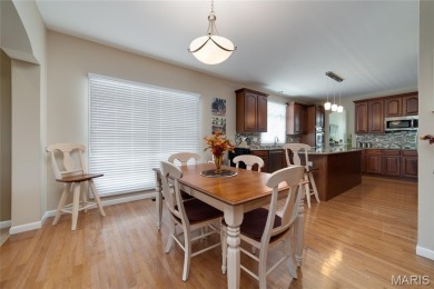 STUNNING 1.5 story villa overlooking the 8th green of on Winghaven Country Club in Missouri - for sale on GolfHomes.com, golf home, golf lot