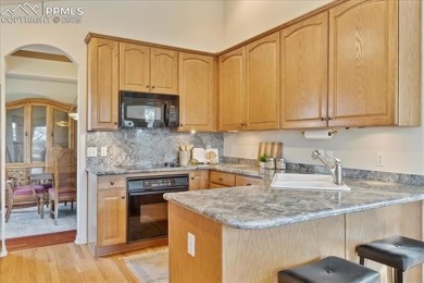 Exquisitely located on the edge of 22 acres of HOA owned forest on The Ridge At Castle Pines North in Colorado - for sale on GolfHomes.com, golf home, golf lot