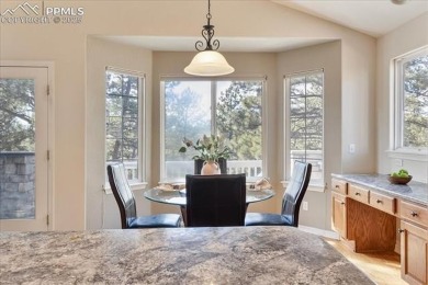 Exquisitely located on the edge of 22 acres of HOA owned forest on The Ridge At Castle Pines North in Colorado - for sale on GolfHomes.com, golf home, golf lot