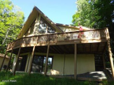 CLASSIC LAKE WALLENPAUPACK PROW FRONT CHALET IN BEAUTIFUL on Paupack Hills Golf and Country Club in Pennsylvania - for sale on GolfHomes.com, golf home, golf lot