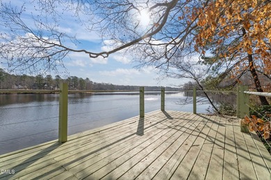 Waterfront living at its finest with this gorgeous 4-bedroom on River Golf and Country Club at Lake Royale in North Carolina - for sale on GolfHomes.com, golf home, golf lot