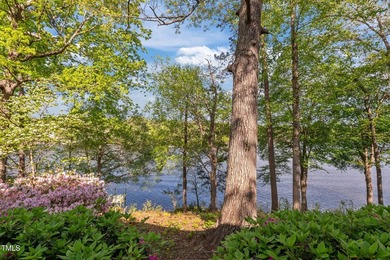Waterfront living at its finest with this gorgeous 4-bedroom on River Golf and Country Club at Lake Royale in North Carolina - for sale on GolfHomes.com, golf home, golf lot