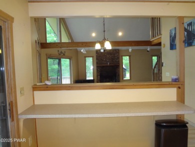 CLASSIC LAKE WALLENPAUPACK PROW FRONT CHALET IN BEAUTIFUL on Paupack Hills Golf and Country Club in Pennsylvania - for sale on GolfHomes.com, golf home, golf lot