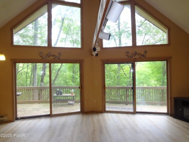 CLASSIC LAKE WALLENPAUPACK PROW FRONT CHALET IN BEAUTIFUL on Paupack Hills Golf and Country Club in Pennsylvania - for sale on GolfHomes.com, golf home, golf lot