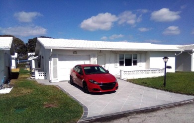 Welcome to Palm Beach Leisureville, a 55+ community! This large on Leisureville Community Golf Course in Florida - for sale on GolfHomes.com, golf home, golf lot