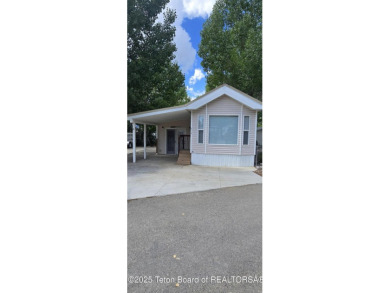 Completely updated park model with a spacious bonus room located on Star Valley RV Golf Course in Wyoming - for sale on GolfHomes.com, golf home, golf lot