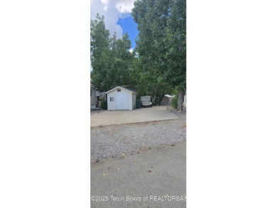 Completely updated park model with a spacious bonus room located on Star Valley RV Golf Course in Wyoming - for sale on GolfHomes.com, golf home, golf lot