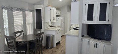 Completely updated park model with a spacious bonus room located on Star Valley RV Golf Course in Wyoming - for sale on GolfHomes.com, golf home, golf lot