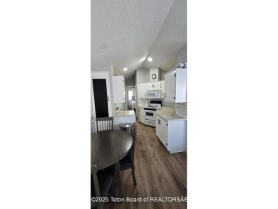 Completely updated park model with a spacious bonus room located on Star Valley RV Golf Course in Wyoming - for sale on GolfHomes.com, golf home, golf lot
