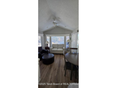Completely updated park model with a spacious bonus room located on Star Valley RV Golf Course in Wyoming - for sale on GolfHomes.com, golf home, golf lot