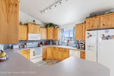 This one-owner residence sits on an oversized 1.12 acre on Star Valley RV Golf Course in Wyoming - for sale on GolfHomes.com, golf home, golf lot