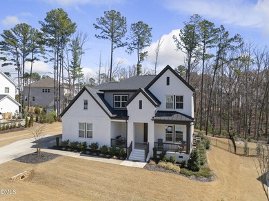 Tucked away on a quiet cul-de-sac in the prestigious Hasentree on Hasentree Club in North Carolina - for sale on GolfHomes.com, golf home, golf lot