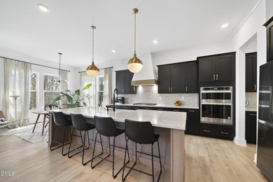 Tucked away on a quiet cul-de-sac in the prestigious Hasentree on Hasentree Club in North Carolina - for sale on GolfHomes.com, golf home, golf lot