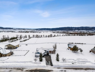 This one-owner residence sits on an oversized 1.12 acre on Star Valley RV Golf Course in Wyoming - for sale on GolfHomes.com, golf home, golf lot