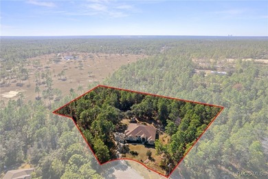 Beautiful Pine Ridge home tucked away on a quiet cul-de-sac on Pine Ridge Community Golf and Country Club in Florida - for sale on GolfHomes.com, golf home, golf lot