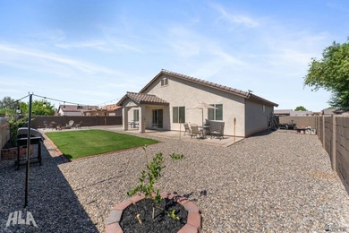This charming ranch-style 3 bedroom home in the rapidly growing on The Links At Coyote Wash in Arizona - for sale on GolfHomes.com, golf home, golf lot