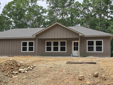 Perfect new construction home on a level lot. Home is currently on Diamondhead Golf and Country Club in Arkansas - for sale on GolfHomes.com, golf home, golf lot
