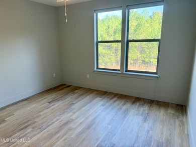 Discover the perfect blend of comfort, convenience, and coastal on Gulf Hills Golf Club in Mississippi - for sale on GolfHomes.com, golf home, golf lot