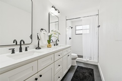 Welcome to this beautifully updated pool home overlooking the on Northdale Golf and Tennis Club in Florida - for sale on GolfHomes.com, golf home, golf lot