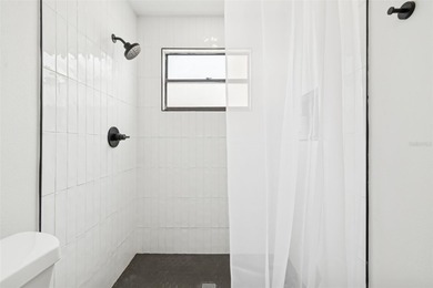 Welcome to this beautifully updated pool home overlooking the on Northdale Golf and Tennis Club in Florida - for sale on GolfHomes.com, golf home, golf lot