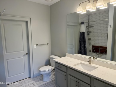 Discover the perfect blend of comfort, convenience, and coastal on Gulf Hills Golf Club in Mississippi - for sale on GolfHomes.com, golf home, golf lot