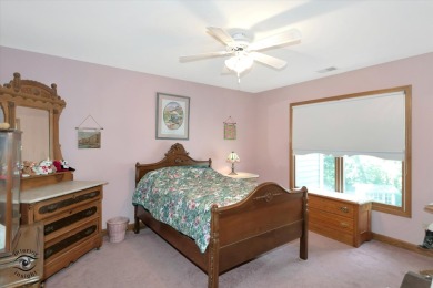 Situated on a tranquil street with picturesque views of the on Ravisloe Country Club in Illinois - for sale on GolfHomes.com, golf home, golf lot