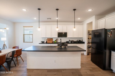 LOWEST-PRICED HOME IN THE AREA! Discover elevated desert living on Verrado Golf Club  in Arizona - for sale on GolfHomes.com, golf home, golf lot