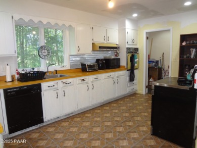LARGE LAKE WALLENPAUPACK HOME WITH GOLF COURSE VIEWS IN on Paupack Hills Golf and Country Club in Pennsylvania - for sale on GolfHomes.com, golf home, golf lot