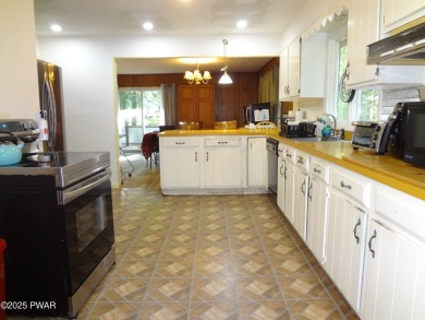 LARGE LAKE WALLENPAUPACK HOME WITH GOLF COURSE VIEWS IN on Paupack Hills Golf and Country Club in Pennsylvania - for sale on GolfHomes.com, golf home, golf lot