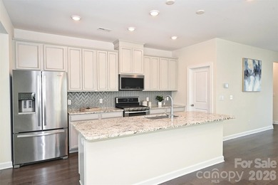 This elegant three story end-unit townhome located at City Park on Renaissance Park Golf Course in North Carolina - for sale on GolfHomes.com, golf home, golf lot