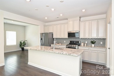 This elegant three story end-unit townhome located at City Park on Renaissance Park Golf Course in North Carolina - for sale on GolfHomes.com, golf home, golf lot