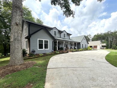 Explore this 4-bedroom, 3.5-bathroom home nestled alongside a on Catawba Springs Golf Course At Lake Hickory  in North Carolina - for sale on GolfHomes.com, golf home, golf lot