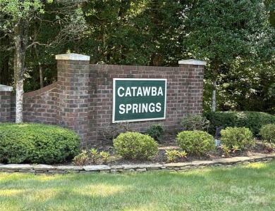 Explore this 4-bedroom, 3.5-bathroom home nestled alongside a on Catawba Springs Golf Course At Lake Hickory  in North Carolina - for sale on GolfHomes.com, golf home, golf lot