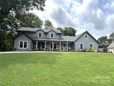 Explore this 4-bedroom, 3.5-bathroom home nestled alongside a on Catawba Springs Golf Course At Lake Hickory  in North Carolina - for sale on GolfHomes.com, golf home, golf lot