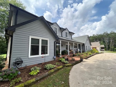 Explore this 4-bedroom, 3.5-bathroom home nestled alongside a on Catawba Springs Golf Course At Lake Hickory  in North Carolina - for sale on GolfHomes.com, golf home, golf lot