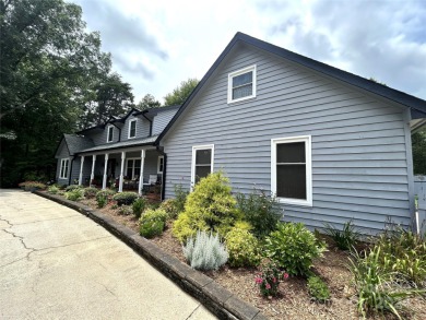 Explore this 4-bedroom, 3.5-bathroom home nestled alongside a on Catawba Springs Golf Course At Lake Hickory  in North Carolina - for sale on GolfHomes.com, golf home, golf lot