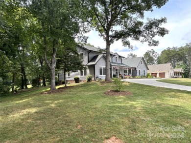 Explore this 4-bedroom, 3.5-bathroom home nestled alongside a on Catawba Springs Golf Course At Lake Hickory  in North Carolina - for sale on GolfHomes.com, golf home, golf lot