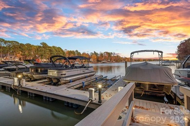 Set on a level one-acre lot on the 5th hole of Trump National on Trump National Golf Club Charlotte in North Carolina - for sale on GolfHomes.com, golf home, golf lot