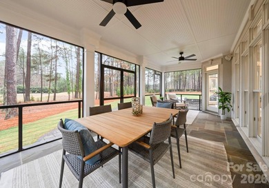 Set on a level one-acre lot on the 5th hole of Trump National on Trump National Golf Club Charlotte in North Carolina - for sale on GolfHomes.com, golf home, golf lot