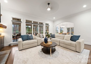 Set on a level one-acre lot on the 5th hole of Trump National on Trump National Golf Club Charlotte in North Carolina - for sale on GolfHomes.com, golf home, golf lot