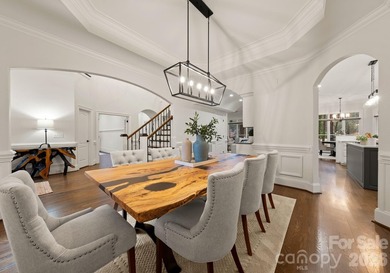 Set on a level one-acre lot on the 5th hole of Trump National on Trump National Golf Club Charlotte in North Carolina - for sale on GolfHomes.com, golf home, golf lot