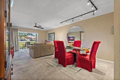 Relaxing is easy from this ideally located golf course condo in on Isla Del Sol Yacht and Country Club in Florida - for sale on GolfHomes.com, golf home, golf lot